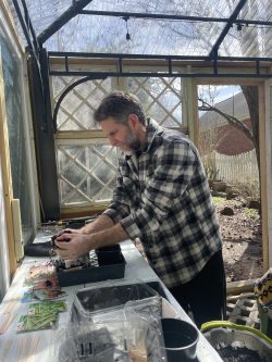 James working in the greenhouse.