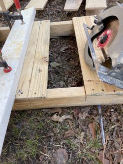 Cutting palettes to size for shelf stands.